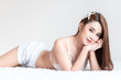 © Sasils Production - Cute asian woman laying in bed. Looking at camera, big smile. In bedroom. Sexy and cute concept.