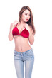 © Sasils Production - Cute asian woman in red bikini and jeans isolated in white background. Looking to the right. Sexy summer concept.