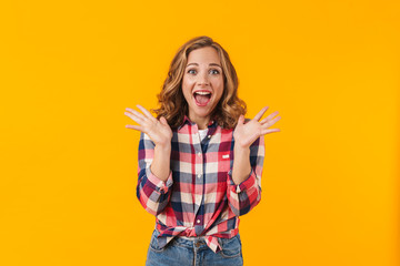 Wall Mural - Image of young beautiful happy woman screaming and gesturing in delight