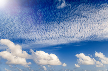 Wall Mural - beautiful clouds against a blue sky. background and holiday concept