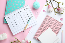 Flat Lay Composition With Calendar And Stationery On Color Background