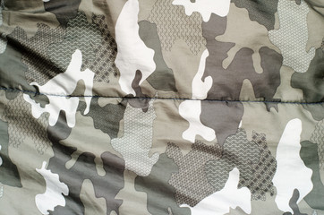 Camouflage fabric texture background. Factory material