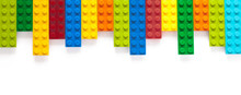 Colored Toy Bricks On White Background