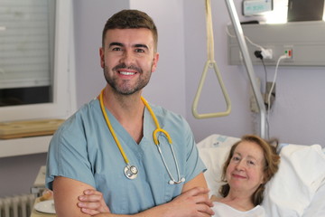 Wall Mural - Male nurse smiling at work 