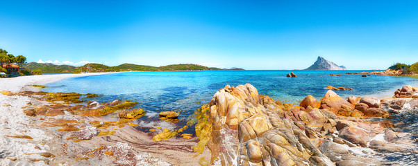 Wall Mural - Fantastic azure water with rocks near beach Porto Taverna.