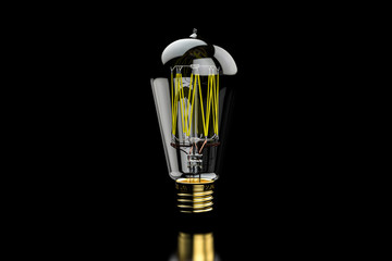 Glowing Tungsten vintage light bulb lamp on black background. Idea, concept. Edison Style Bulb.