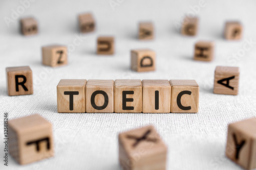 TOEIC - words from wooden blocks with letters, Test of English for International Lerretsbilde