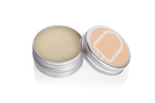 Lip Balm In Metallic Tins Isolated On A White Background