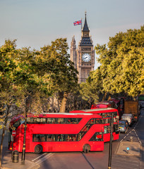 Fototapete - Big Ben with red buses in London, England, UK