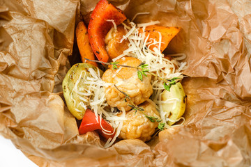 Baked vegetables in craft paper. Concept of catering, hospitality and lifestyle