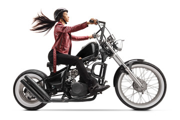 Wall Mural - Young woman riding a custom black motorcycle