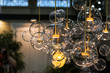 © Olha - Lighting balls on the chandelier in the lamplight, light bulbs hanging from the ceiling.