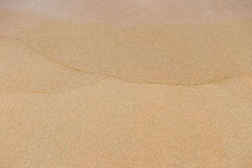 Natural sand texture background, wave pattern on blank brown sand background