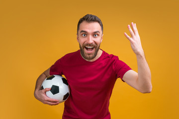 Wall Mural - Young attractive bearded man betting at bookmaker's website