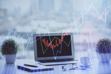 Forex Chart hologram on table with computer background. Multi exposure. Concept of financial markets.