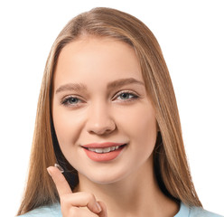 Canvas Print - Young woman with contact lens on white background