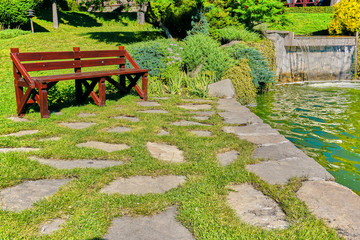 Bank next to flowing water in the backyard garden