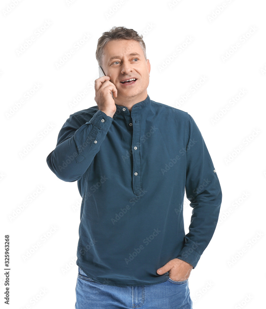 Mature man talking by mobile phone on white background