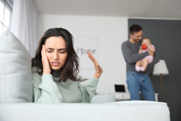 Poster - Happy father with his baby and wife suffering from postnatal depression at home