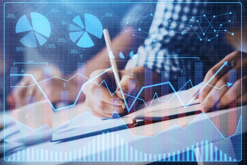 Multi exposure of two men planing investment with stock market forex chart.