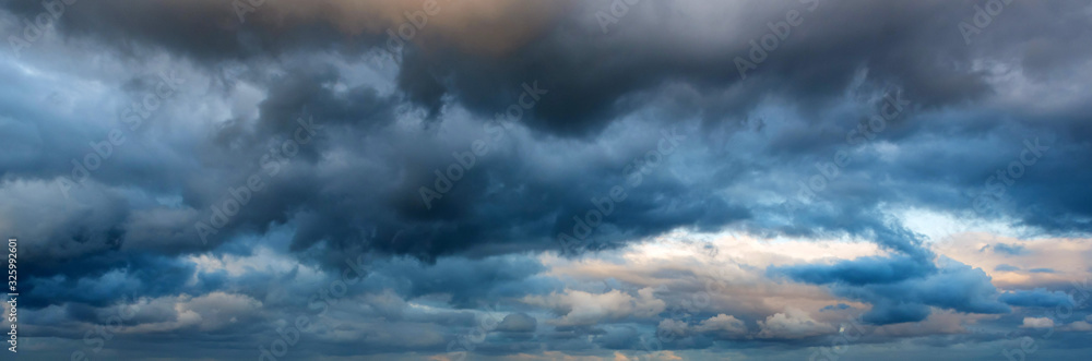 Dramatic panoramic skyscape with dark stormy clouds - obrazy, fototapety, plakaty 