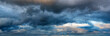 Leinwandbild Motiv Dramatic panoramic skyscape with dark stormy clouds