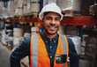 Smiling warehouse manager in safety vest and hard hat
