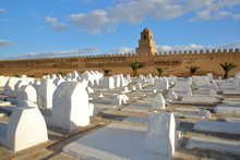 The Great Mosque Of Kairouan, Tunisia, Viewed From Outside The Ramparts And With Whitewashed Tombs In The Foreground