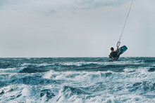 Kite Surfing In Storm In Winter With Extreme High Jumps.