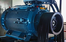 Industry. High Power Electric Motor With Power Transmission Belts. Close-up.