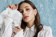 Close Up Portrait Of Beautiful Fashionable Woman With Natural Flawless Skin, Wearing Trendy Vintage Style White Blouse, Pearl Earrings. Spring, Summer Fashion, Beauty Concept