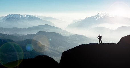 Aufkleber - Spectacular mountain ranges silhouettes. Man reaching summit enjoying freedom.
