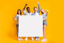 Positive Group Of Teenagers Standing Together With White Placard