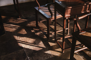 ancient chinese chair with strong side light at morning