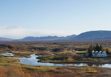 Old Church And Small Village With Stream And Mountain Background Near Thingvellir National Park, Iceland