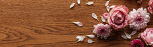 Top View Of Blooming Pink Spring Flowers And Petals On Wooden Background, Panoramic Shot