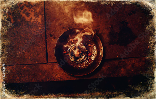 Frankincense burning on a hot coal Canvas Print
