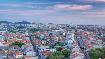 Wall Mural - Rooftops of Porto's old town on a warm spring day timelapse day to night, Porto, Portugal