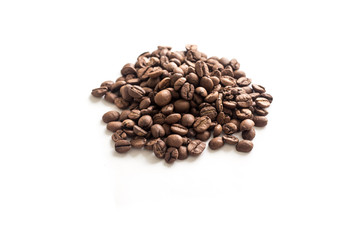 Roasted coffee beans on white background