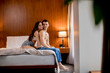 © BGStock72 - View at affectionate young lovers embracing on bed