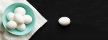 Traditional Easter Food Eggs. Colored Dishes On A White Napkin And Black Background. Minimalistic Design. Copy Space. Colors Trend 2020