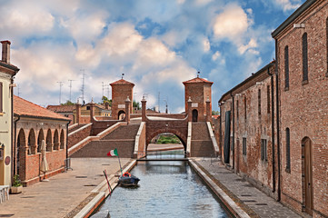 Wall Mural - Comacchio, Ferrara, Emilia Romagna, Italy: the ancient five-way bridge Trepponti in the old town known as the Little Venice