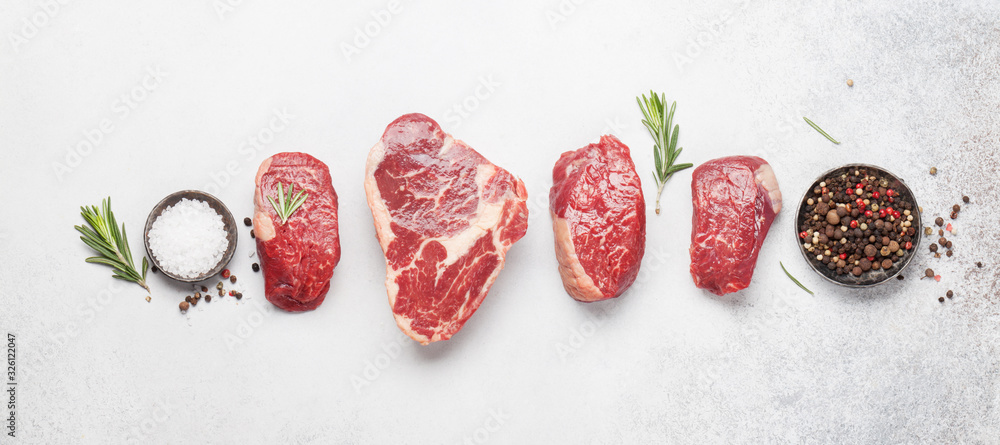 Variety of raw beef steaks - obrazy, fototapety, plakaty 
