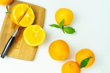  cut orange on a wooden board. Fresh fruits, food on a white background.