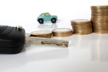 Miniature people with coins and car. Miniature businessman walking through a toy car. Concept of financial, retail, money saving and business. Turkey car price infilation. Car mortgage related