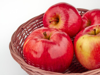 Bright beautiful red apples on a colored background