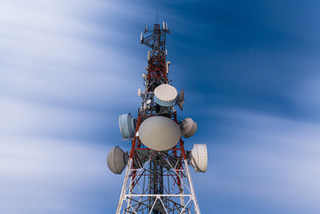 Telecommunication towers for mobile communications in the starry night. communication and industry concept.