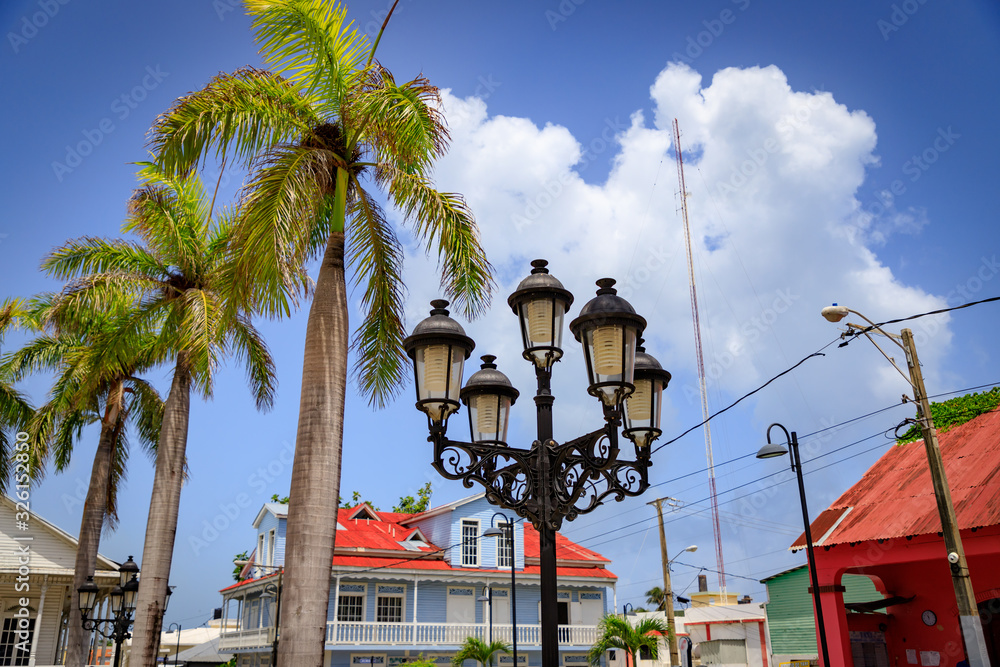 Obraz na płótnie Historical street lamps in colonial style and palm trees in the old town of Puerto Plata, Dominican Republic, Caribbean. w salonie