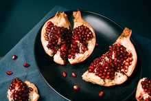 Fresh Ripe Pomegranate Open On Plate