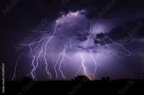 Cuadros en Lienzo Huge thunderstorm hits at night